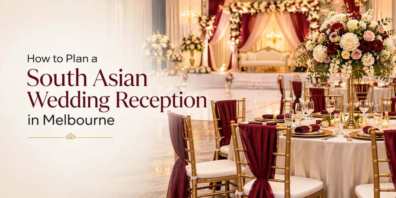 South Asian wedding reception setup in Melbourne with elegant gold chairs, burgundy décor, floral centerpieces, and a decorated stage.