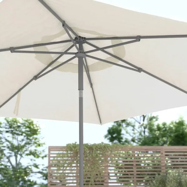 White outdoor umbrella providing shade in a Melbourne event setting.